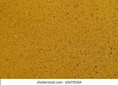 Close up of yellow sponge texture for backgrounds