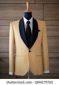 Close Up Of Yellow Tuxedo Suit With Black Tie And White Shirt Detail. Bespoke Tailor. Luxury Suit