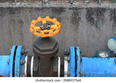 Close Up Yellow Water Valve, Outdoor Main Water Shut-off Valve System.
