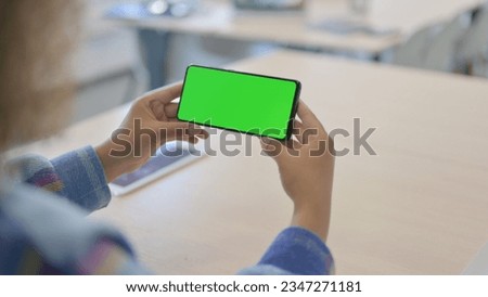 Close Up of Young African Woman Holding Phone with Chroma Key Screen