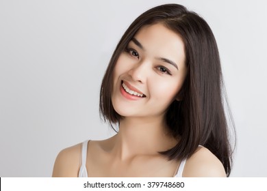 Close Up Of Young Asian Beautiful Woman With Smiley Face.