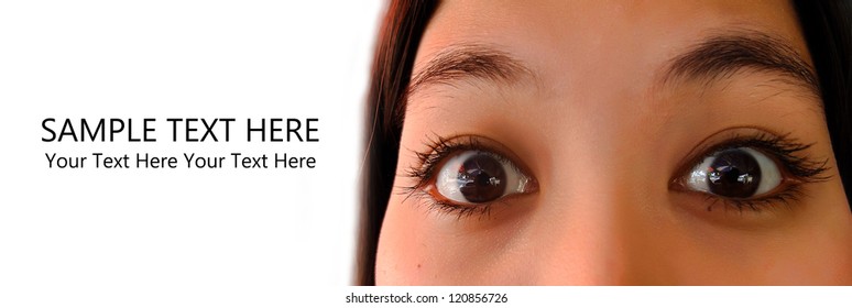 Close Up Of Young Asian Woman Eyes Feel Excited With Sample Text On White Background