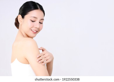 Close Up Of Young Beautiful Asian Woman Touch Her Shoulder Gently With Copy Space