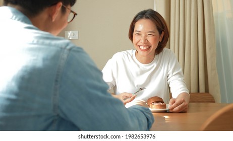 Close Up Young Beautiful Asian Woman Talking To Friends During Eating Cake On The Table In The Cafe With Happiness Feeling In Relax Day For Mental Health And Relationship Concept