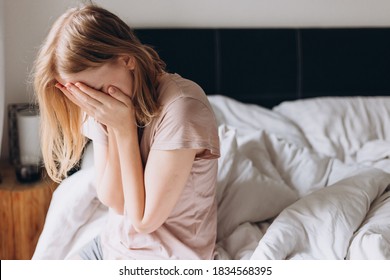 Close Up Young Blonde Woman Feeling Upset, Sad, Unhappy Or Disappoint Crying Lonely In Bedroom. Emotional Shock And Life Problems