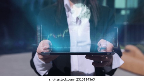 Close up of young businesswoman using digital computer tablet near office building. Bar graph with auto trading computer coding artificial intelligence technology, AI.