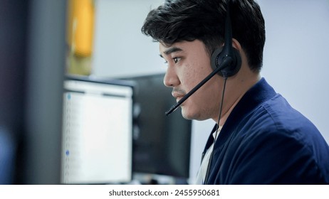 close up young call center asian man wear headset and smiling while working in office with service-mind for 24 hour and 7 day support of telemarketing and helpdesk agent  concept - Powered by Shutterstock