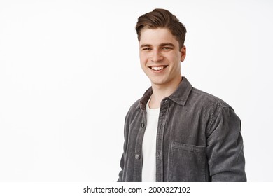 Close Up Of Young Candid Guy, Handsome Man Smiling White Teeth, Standing Relaxed And Casual Against Isolated Studio Background, Looking Happy, White Background