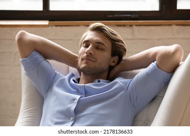 Close Up Of Young Caucasian Man Sit Relax In Armchair Sleeping Or Taking Nap At Home. Calm Millennial Male Renter Rest In Cozy Comfortable Chair Relieve Negative Emotions. Peace, Stress Free Concept.