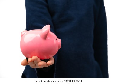 Close Up Of Young Entrepreneur Holding Piggy Bank. Financial Education For Kids.