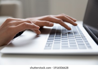 Close Up Of Young Female Hands Typing On Keyboard Of Modern Laptop Computer Browse Internet Search Data Information On Web. Cropped Shot Of Millennial Woman Pc User Work On Distance Online Communicate