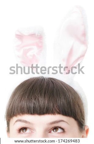 Young blonde woman wearing rabbit ears