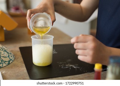 Close Up Of Young Girl Conducting A Science Experiment At Home