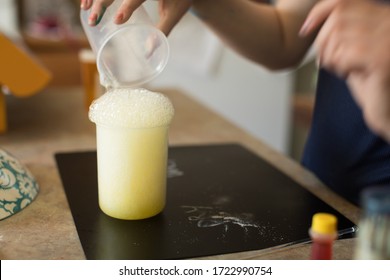 Close Up Of Young Girl Conducting A Science Experiment At Home