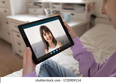 Close Up Of Young Girl Talk Chat On Video Call On Tablet With Smiling Little Girlfriend, Quarantine At Home, Teen Child Have Online Webcam Conversation With Sister Or Friend, Use Modern Pad Device