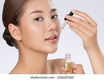 Close up young gorgeous girl with healthy fresh skin holding CBD oil. Combination of beauty and cannabis concept. - Shutterstock ID 2206207601