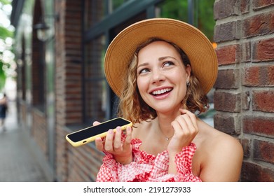 Close Up Young Happy Smiling Woman In Pink Dress Hat Record Voice Message On Mobile Cell Phone Walk In City Center Stand Outdoor Near Town Brick Old Building People Urban Summer Time Lifestyle Concept