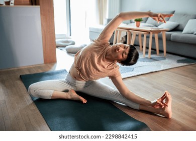 Close up of a Young Japanese woman doing yoga at home