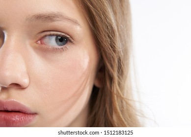 Close up of young lady half face. Girl staring at something and keeping mouth slightly open - Shutterstock ID 1512183125