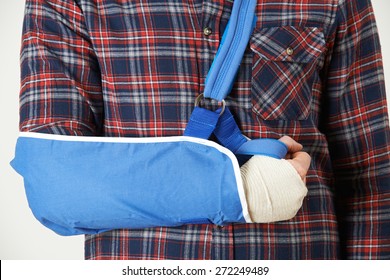 Close Up Of Young Man With Arm In Sling