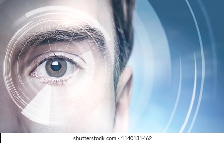 Close up of a young man face with a big brown eye. A HUD interface against a blurred city background. Concept of hi tech. Toned image double exposure mock up