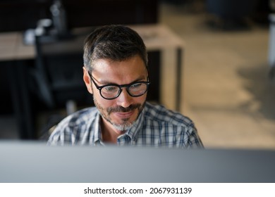 Close Up Young Man in Fashion Glasses Eye Looking Monitor, Surfing Internet. Stylish Male Working With computer From Home in Him Home Office. The Monitor Screen Is Reflected In The Glases
 - Shutterstock ID 2067931139