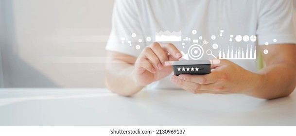 close up young man hand touch screen on digital tablet to use marketing tool and check traffic research of pay per click program on web page for online business and lifestyle concept - Shutterstock ID 2130969137