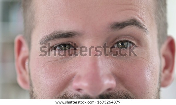 Close Up of Young Man\
Raising Eyebrows