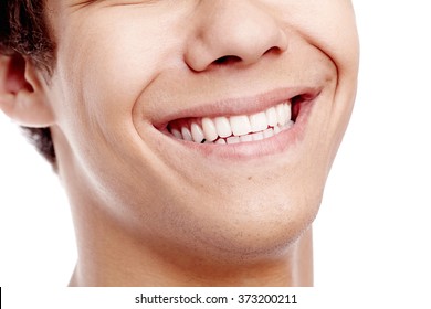 Close Up Of Young Man Smiling With Perfect Healthy White Teeth Isolated On White Background - Dental Care Concept