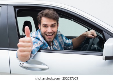 Close Up Of Young Man Smiling And Showing Thumbs Up In His Car