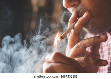 Close Up Young Man Smoking A Cigarette.