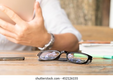 Close up of a young man using mobile smart phone and tablet focus on his hand with mining light