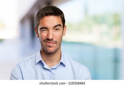 Close Up Of A Young Man Winking An Eye