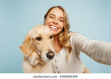 Close up young owner woman with her best friend retriever dog wearing casual clothes do selfie shot pov mobile cell phone isolated on plain pastel light blue background. Take care about pet concept - Powered by Shutterstock