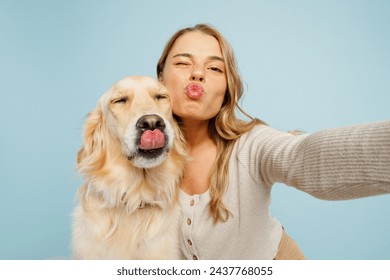 Close up young owner woman with her best friend retriever dog wear casual clothes do selfie shot pov mobile cell phone wink isolated on plain pastel light blue background. Take care about pet concept - Powered by Shutterstock