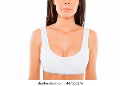 Close up of young perfect shapely woman in white bra