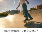 Close up of young skateboarder flies with his board on the ramp of a skate park