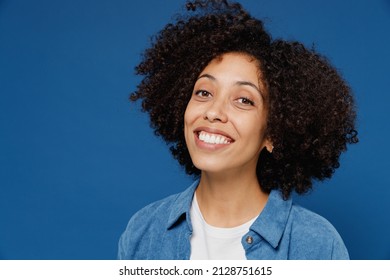 Close Up Young Smiling Beautiful Satisfied Happy Black Woman In Casual Clothes Shirt White T-shirt Looking Camera Isolated On Plain Dark Blue Color Background Studio Portrait. People Lifestyle Concept