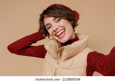 Close Up Young Smiling Happy Laughing Woman 20s In Red Turtleneck Vest Beret Doing Selfie Shot Pov On Mobile Phone Isolated On Plain Pastel Beige Background Studio Portrait. People Lifestyle Concept