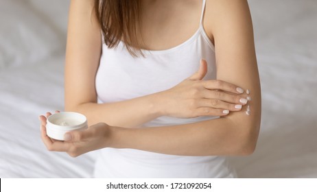 Close Up Of Young Woman Apply Put Moisturizing Body Cream On Arm, Take Care Of Hands, Girl Use Nourishing Balm Or Moisturizer For Soft Healthy Skin, Do Daily Beauty Treatment, Skincare Concept