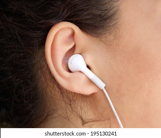 Close Up Young Woman Ear With Earphone 