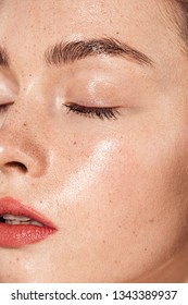 Close Up Of Young Woman With Eyes Closed, Coral Lips And Wet Skin