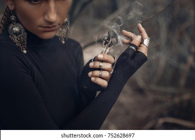 Close Up Of Young Woman Hands Holding Incense