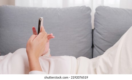 Close Up Of Young Woman Hands Using And Holding Smart Phone, Scrolling Up And Down On Touchscreen, Texting Message 