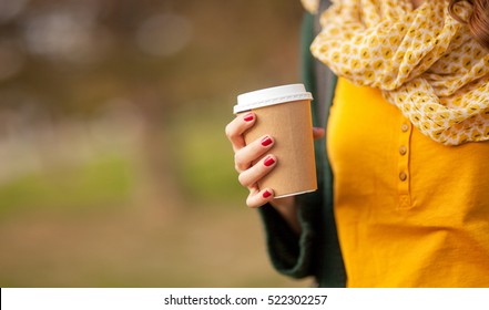 Close Up Of Young Woman Holding A Cup Of Takeaway Coffee Cup, Shallow Depth Of Field