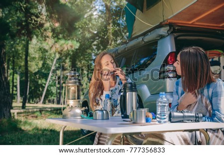 Similar – Image, Stock Photo Young women looking road map with vehicle on background