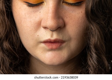 Close Up Of Young Woman Puckering Her Lips.