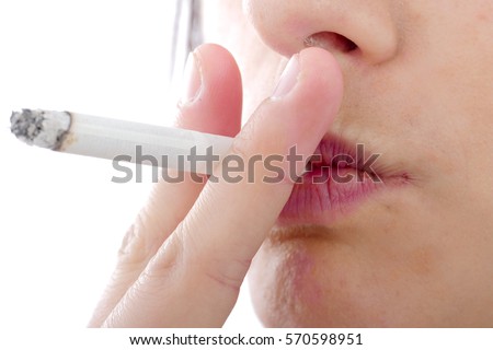 close up of young woman smoking a cigarette