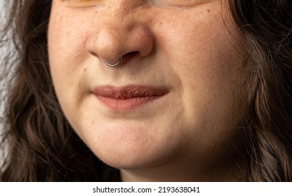 Close Up Of Young Woman Turning Up Her Nose