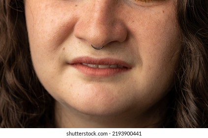 Close Up Of Young Woman Turning Up Her Nose